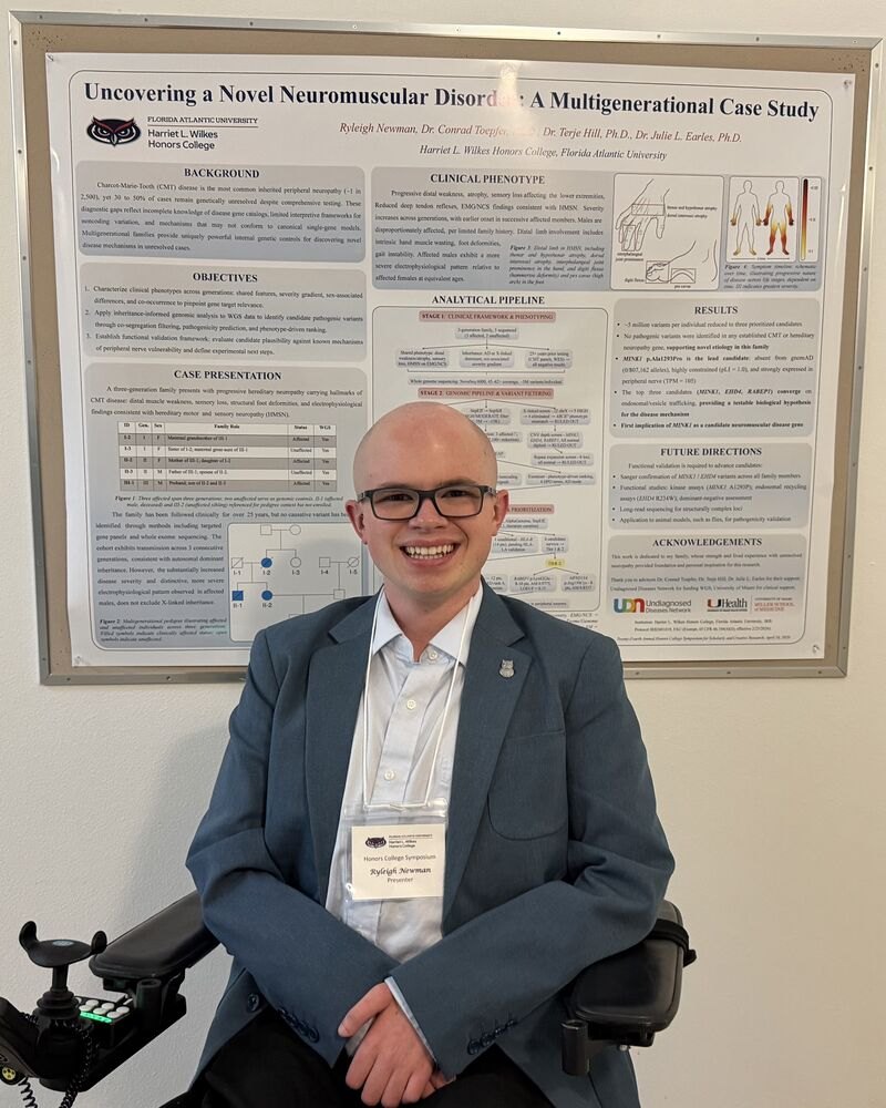 Ryleigh Newman beside his research poster at the Honors College Symposium.